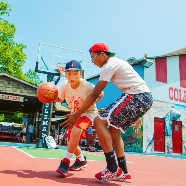Two campers playing basketball