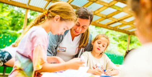 Arts and crafts counselor helps campers