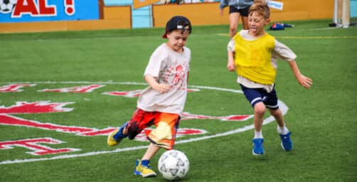 Kids playing soccer.