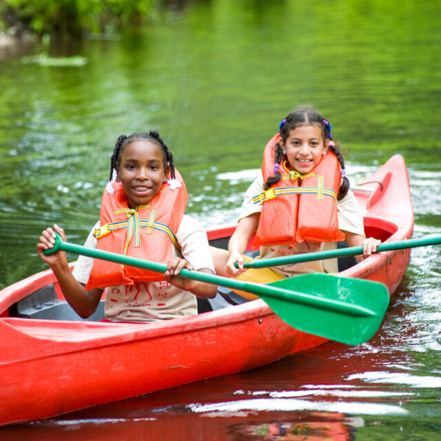 Scout campers canoeing.