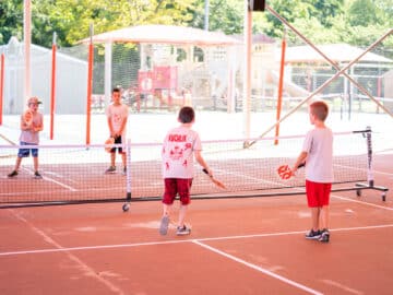 Campers playing pickleball.