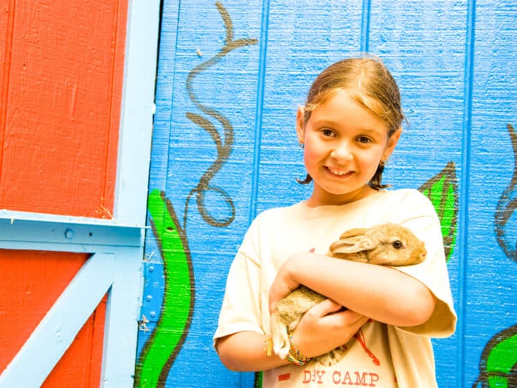 Girl holding a bunny.