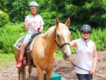 Camper riding a horse.