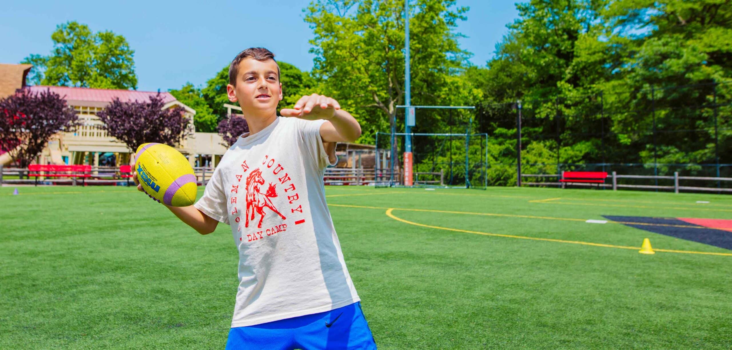 Camper prepares to throw football