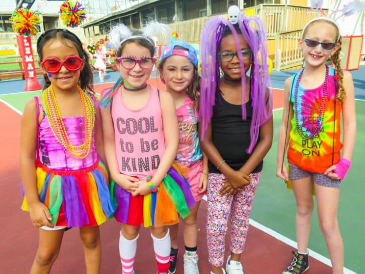 Group of young campers in colorful outfits