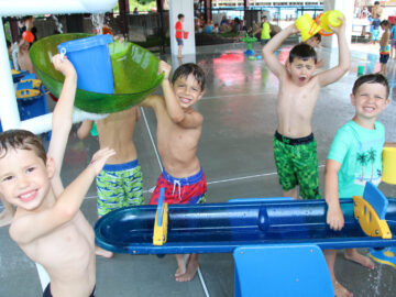 Campers playing with water toys.