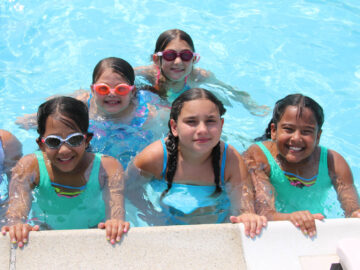 Group of girl campers in the pool.