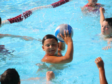 Boy playing water polo.