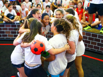 Group of girls hug after GaGa game