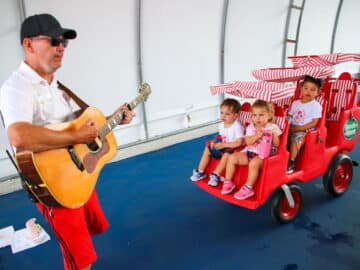 Counselor playing guitar for PIT campers.