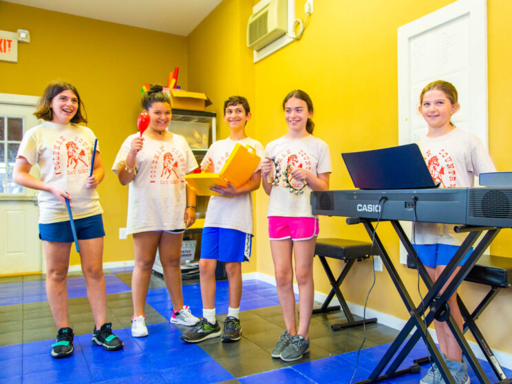 Group of campers perform music