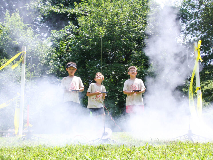 Boys launching rockets.