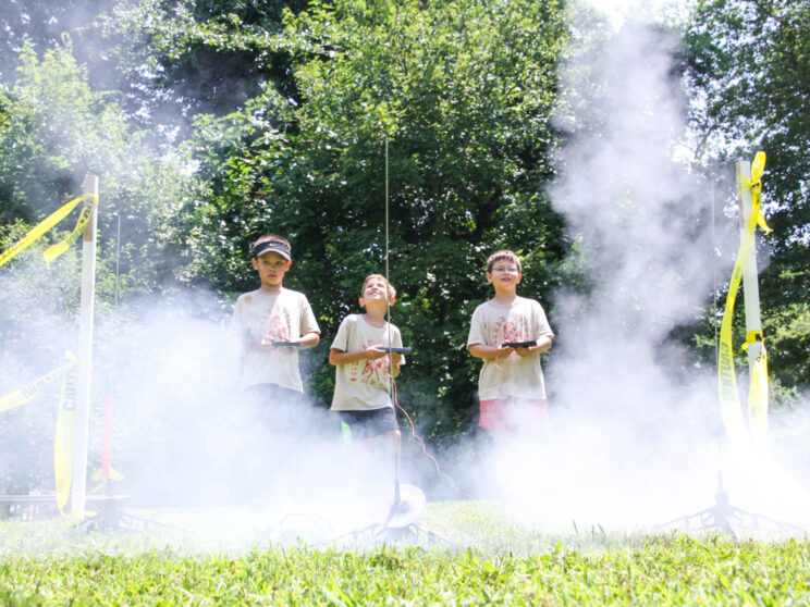 Boys launching rockets.