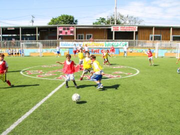 Boys playing soccer at camp