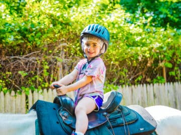 Young camper on a horse.