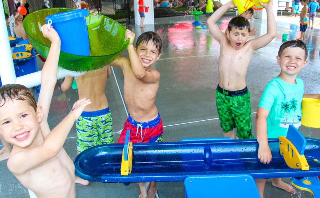 Campers playing with water toys.