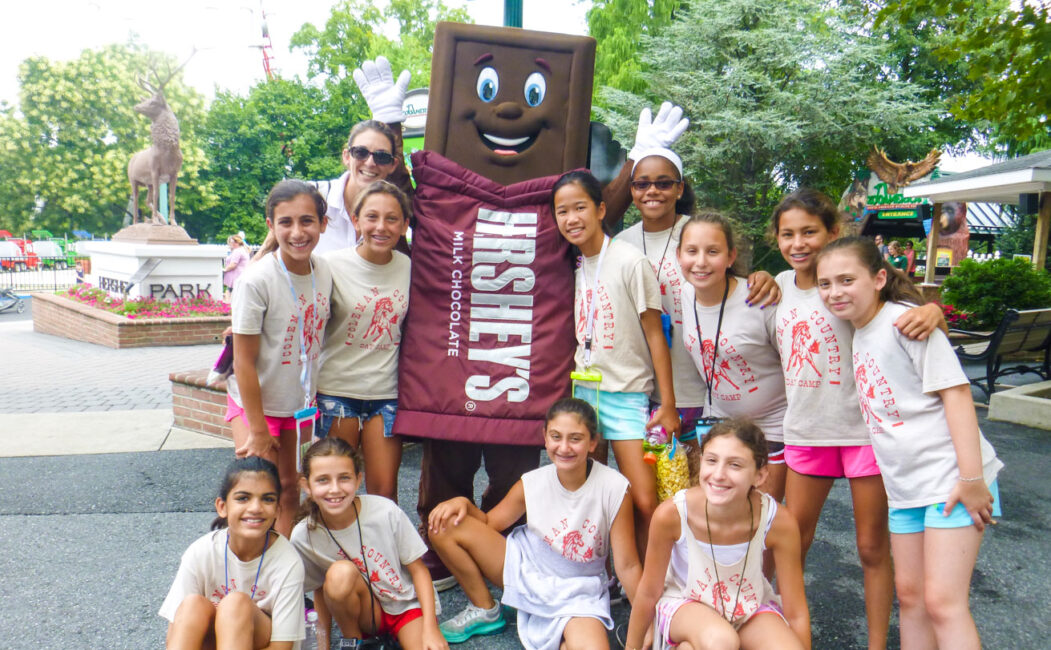 Group of girl campers with the Hershey mascot