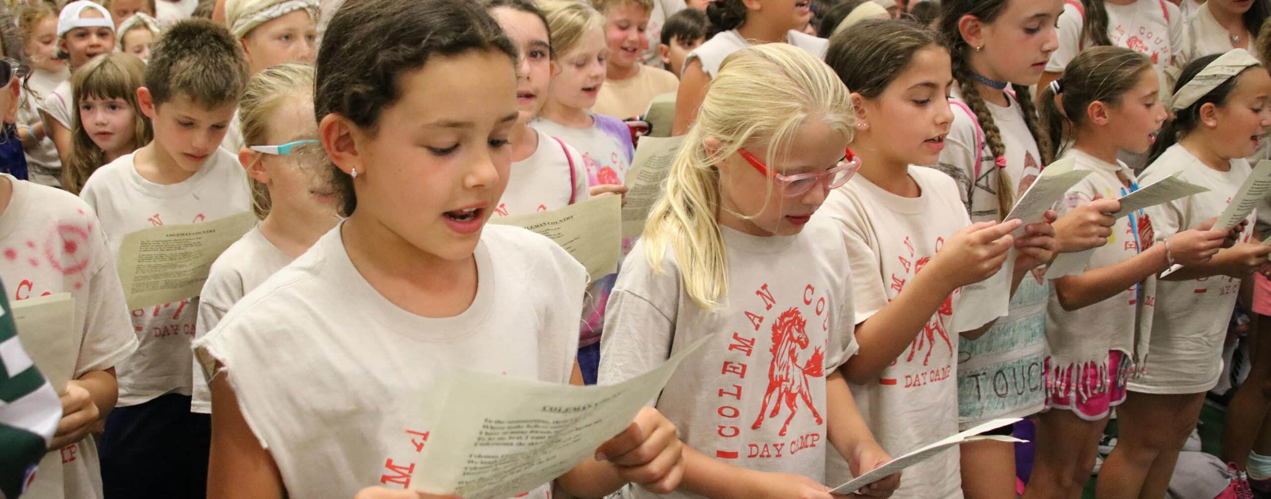 Large group of campers gather for song