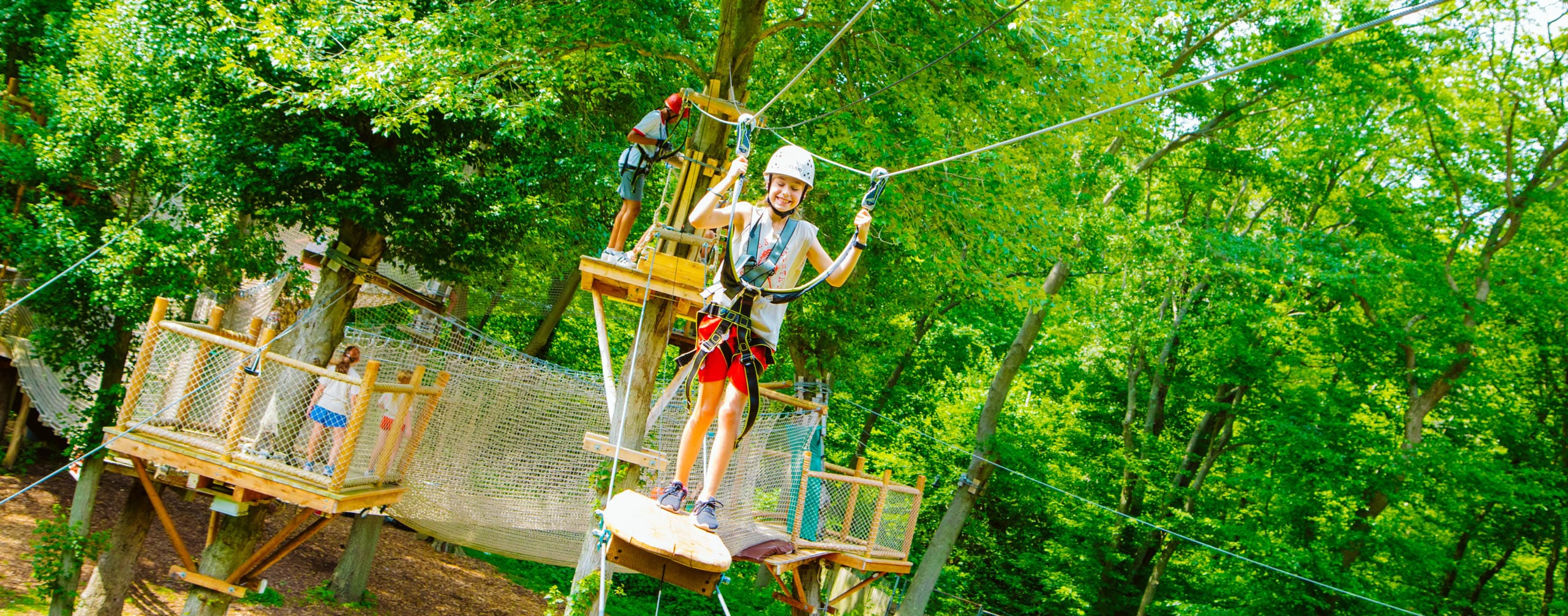 Camper doing the ropes course.