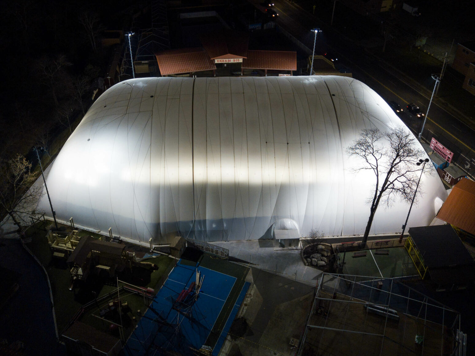 Dome field exterior at night.