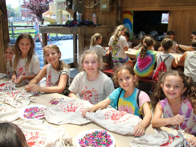 Campers decorating CCDC shirts.