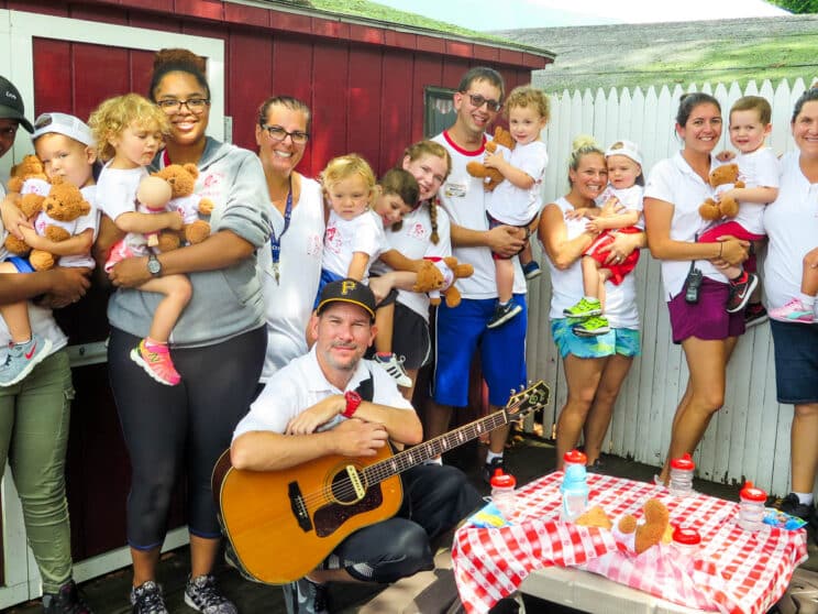 Staff group photo with their kids.