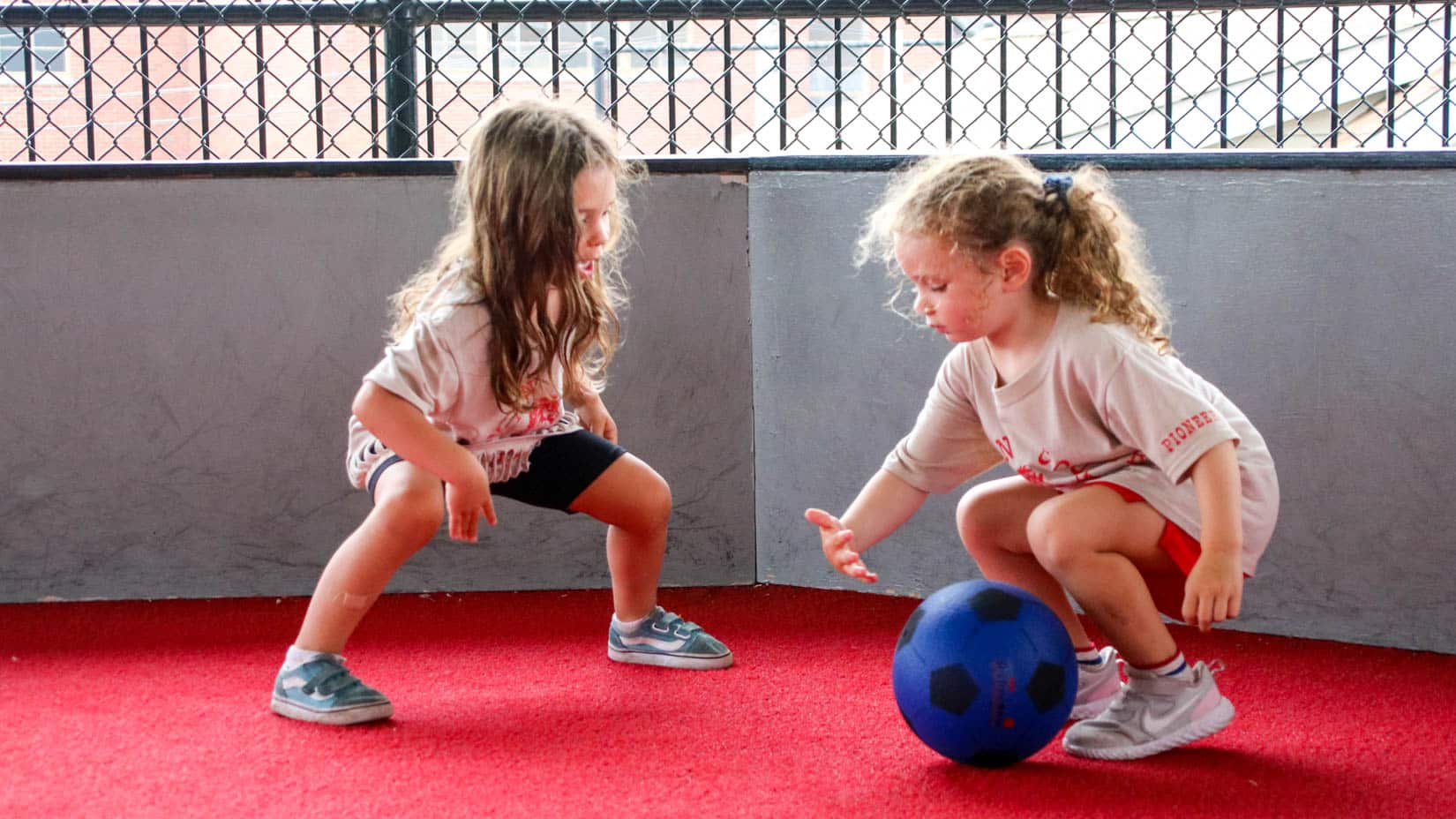 Young campers playing with a Gaga ball.